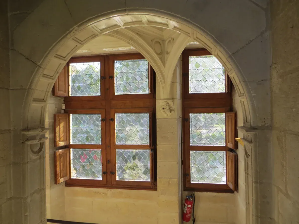 A Renaissance window inside Château d'Azay-le-Rideau, reached by train from Tours without Loire Valley wine and castle tours